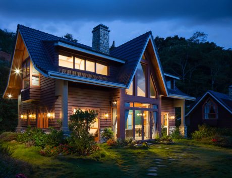 Warmly lit traditional home at dusk